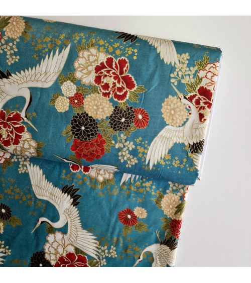 Japanese fabric. Flying Cranes and flowers in greenish blue.