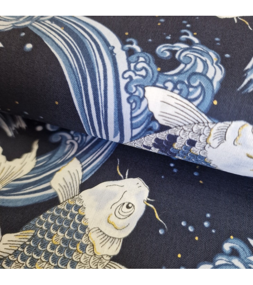 Japanese fabric Koi swimming up the stream in shades of blue.