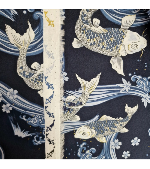 Japanese fabric Koi swimming up the stream in shades of blue.
