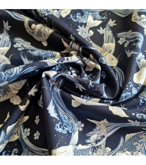 Japanese fabric Koi swimming up the stream in shades of blue.