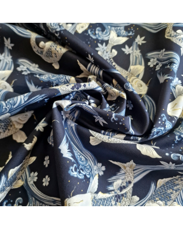 Japanese fabric Koi swimming up the stream in shades of blue.