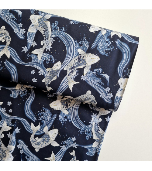 Japanese fabric Koi swimming up the stream in shades of blue.