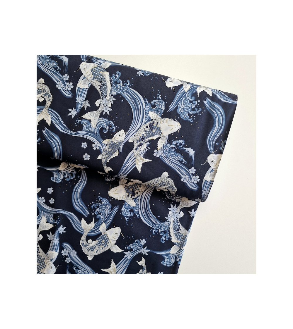 Japanese fabric Koi swimming up the stream in shades of blue.