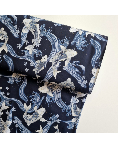 Japanese fabric Koi swimming up the stream in shades of blue.