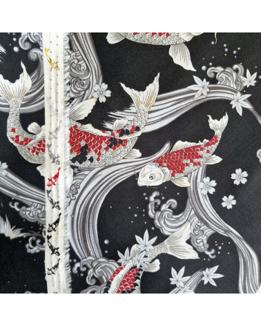 Japanese fabric Red Koi swimming up the stream in black.