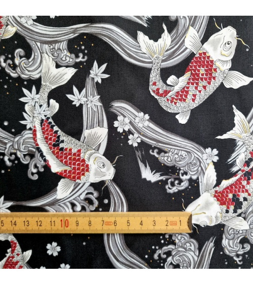Japanese fabric Red Koi swimming up the stream in black.