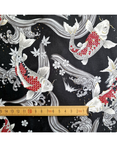 Japanese fabric Red Koi swimming up the stream in black.