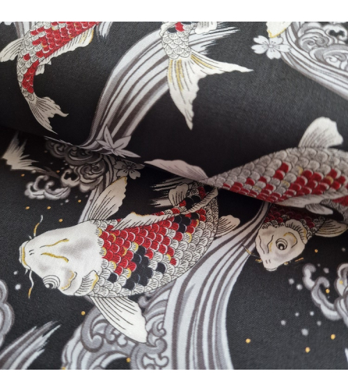 Japanese fabric Red Koi swimming up the stream in black.