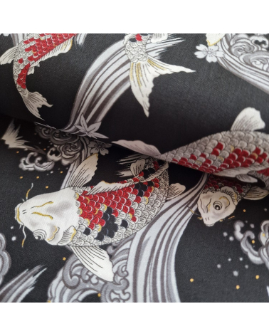 Japanese fabric Red Koi swimming up the stream in black.