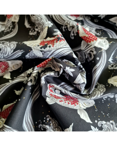 Japanese fabric Red Koi swimming up the stream in black.