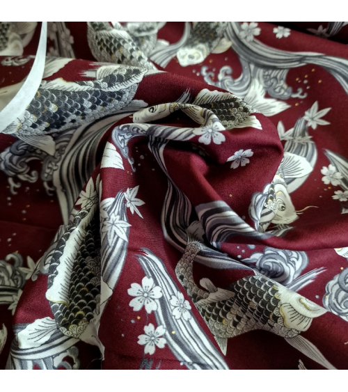 Japanese fabric Koi swimming up the stream in burgundy.
