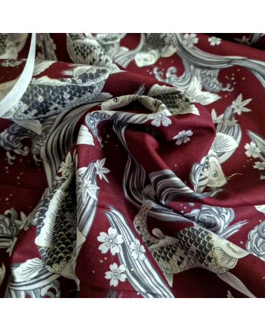 Japanese fabric Koi swimming up the stream in burgundy.