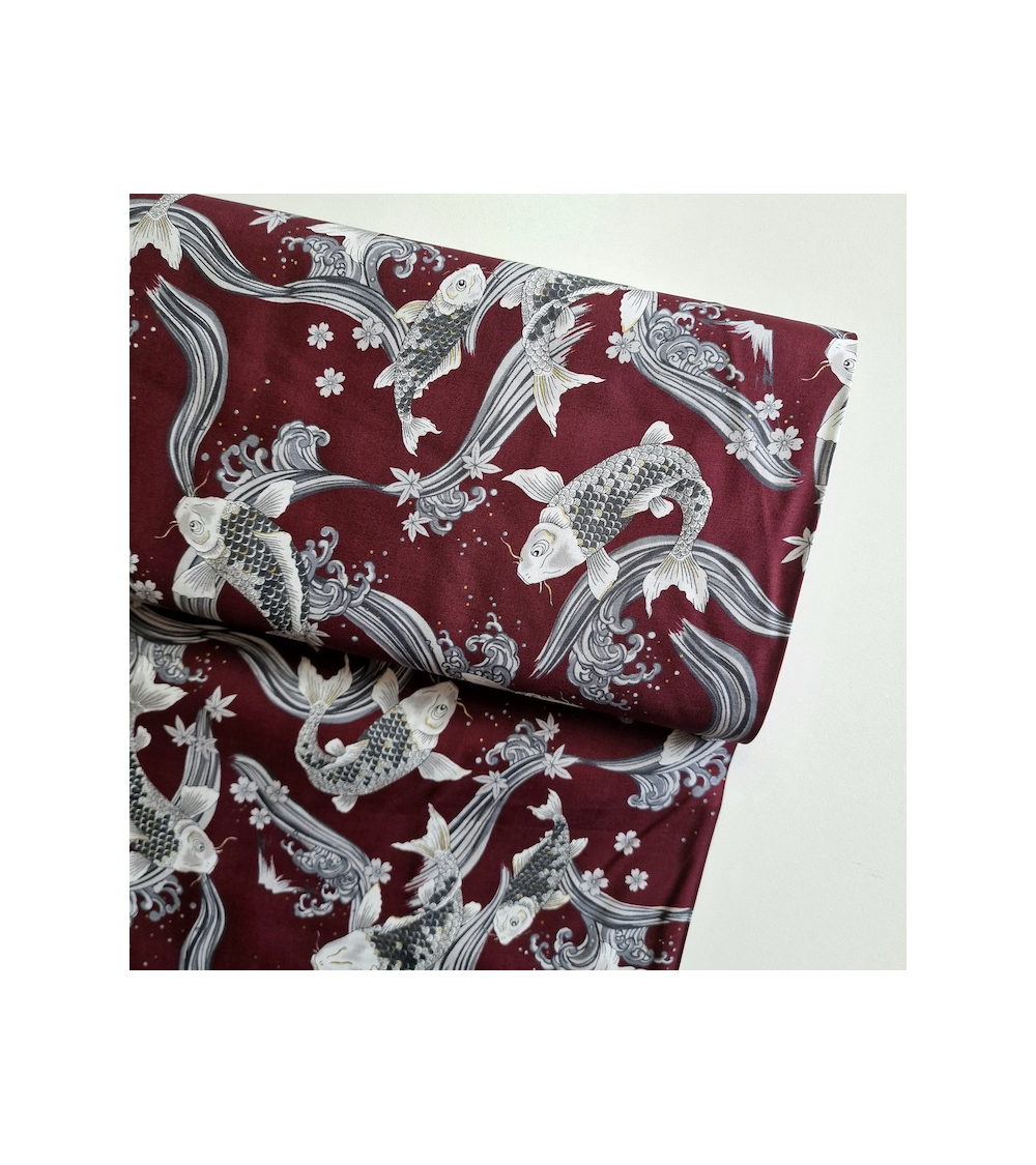 Japanese fabric Koi swimming up the stream in burgundy.