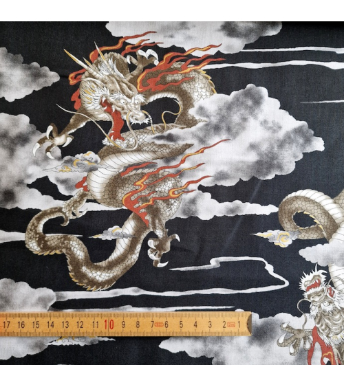 Japanese cotton fabric of dragons and clouds on black.