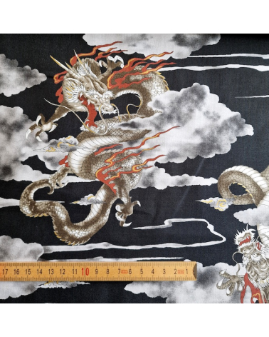 Japanese cotton fabric of dragons and clouds on black.