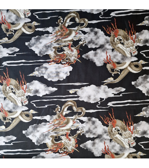 Japanese cotton fabric of dragons and clouds on black.