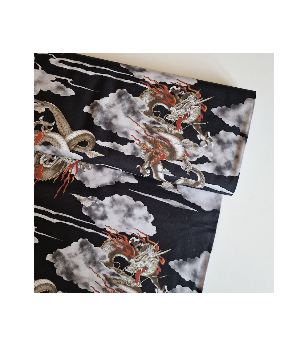 Japanese cotton fabric of dragons and clouds on black.