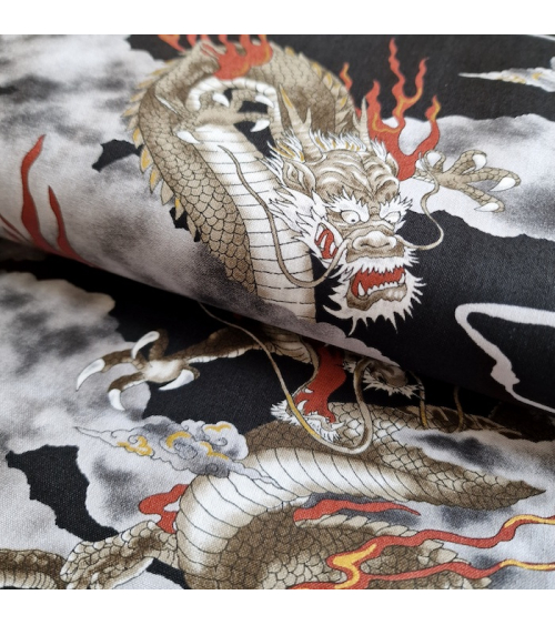 Japanese cotton fabric of dragons and clouds on black.