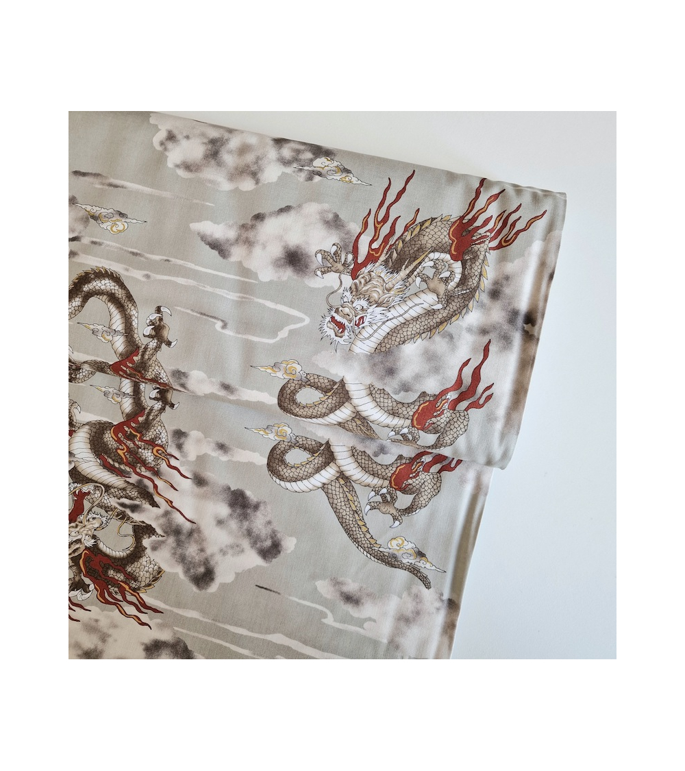 Japanese cotton fabric of dragons and clouds on grey.