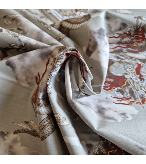 Japanese cotton fabric of dragons and clouds on grey.