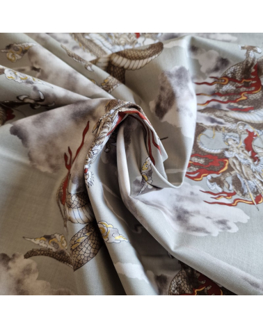 Japanese cotton fabric of dragons and clouds on grey.