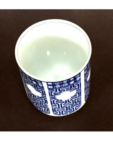 Vaso de té en porcelana con flor de iris
