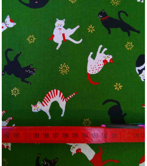 Japanese fabric. Cats over forest green.