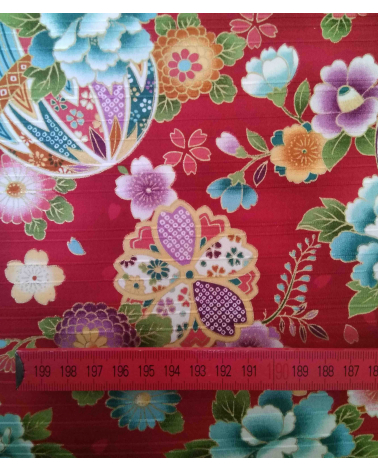 Satin fabric with temari over carmine red background