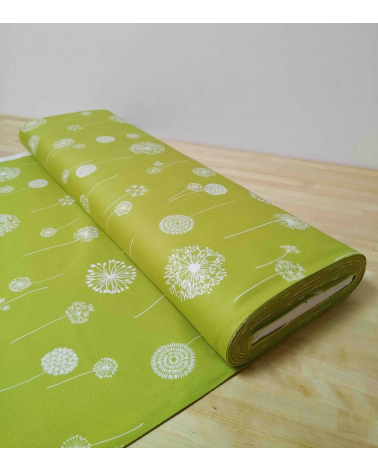 Light oxford Japanese fabric. Dandelion pattern over green.
