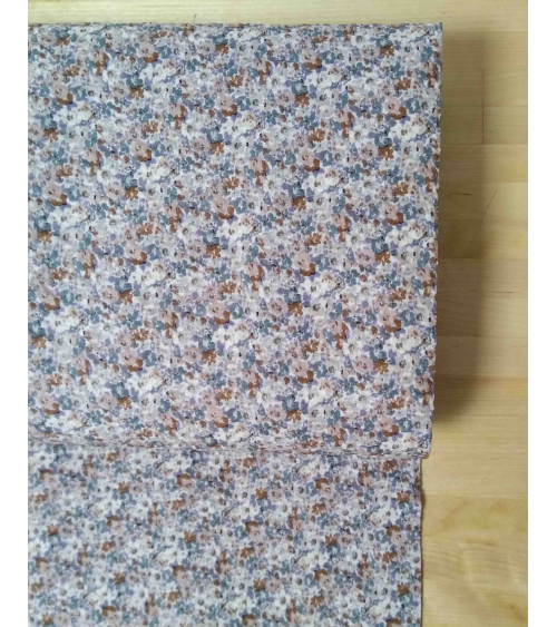 Embossed cotton fabric. Little flowers in muted colors.