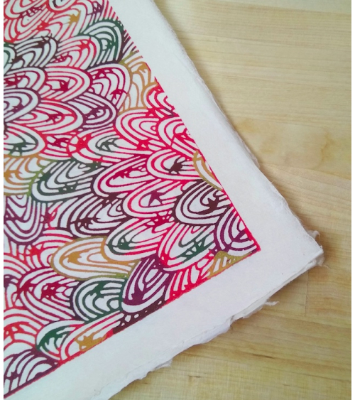 Katazome paper. Reddish curly pattern.