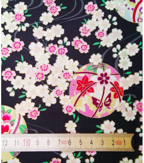Japanese fabric. Sakura and temari over black.