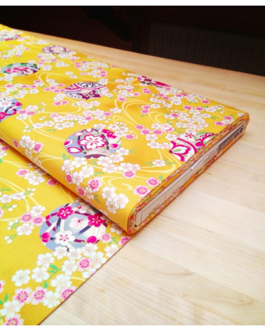 Japanese fabric. Sakura and temari over yellow.