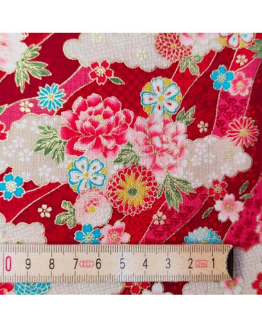 Japanese fabric. Flowers and clouds over red.