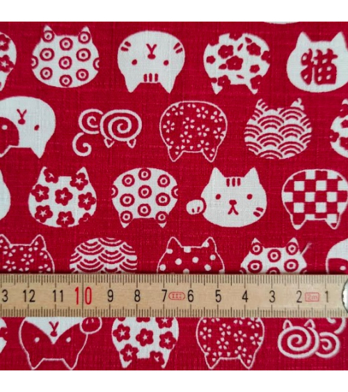 Japanese dobby fabric. Cats' heads in red.