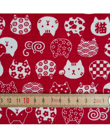 Japanese dobby fabric. Cats' heads in red.