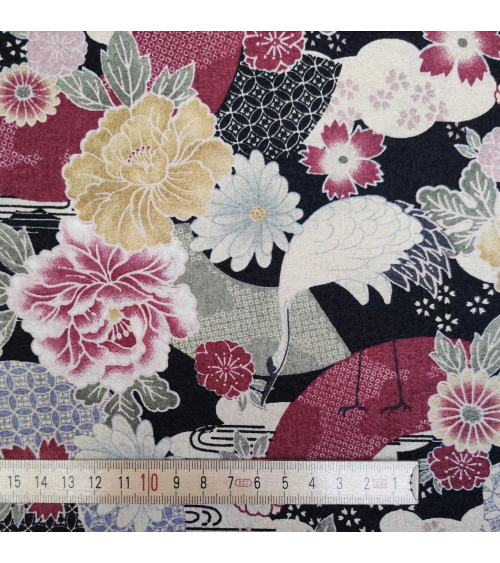 Japanese fabric with cranes and flowers over black in cotton chirimen.