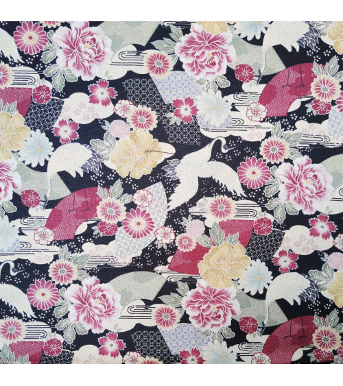 Japanese fabric with cranes and flowers over black in cotton chirimen.