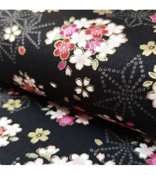 Japanese fabric with sakuras and asanoha on a black background.