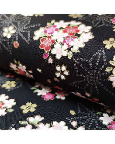 Japanese fabric with sakuras and asanoha on a black background.