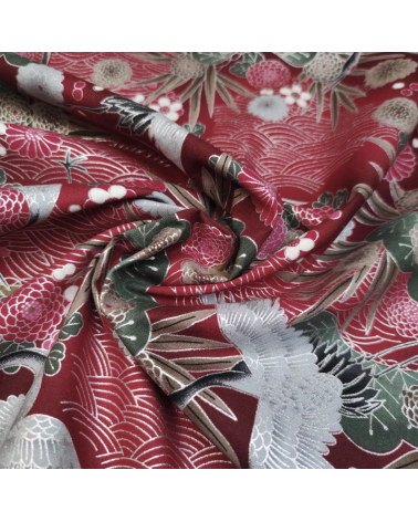 Japanese cotton fabric of cranes in red with silver details.