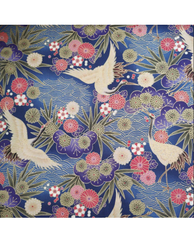 Japanese cotton fabric of cranes in blue with golden details.