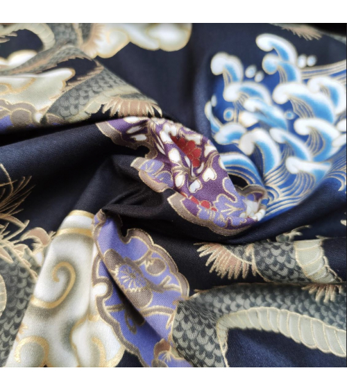 Japanese cotton fabric of dragons, clouds and waves over black.