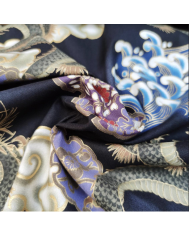 Japanese cotton fabric of dragons, clouds and waves over black.