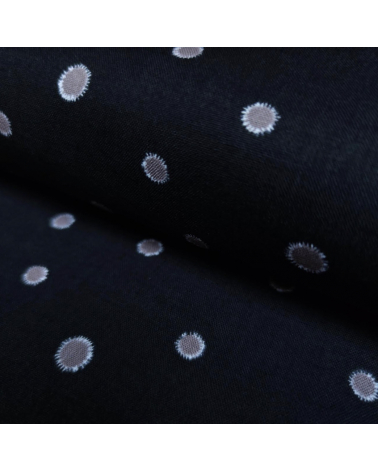 Japanese cotton-linen fabric with irregular polka dots over black background
