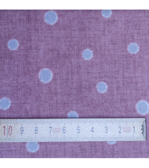 Japanese cotton-linen fabric with irregular polka dots over mauve background