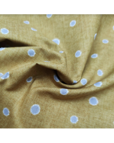 Japanese cotton-linen fabric with irregular polka dots over mustard background