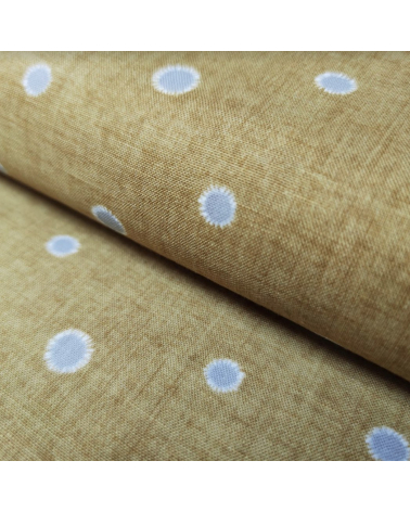 Japanese cotton-linen fabric with irregular polka dots over mustard background