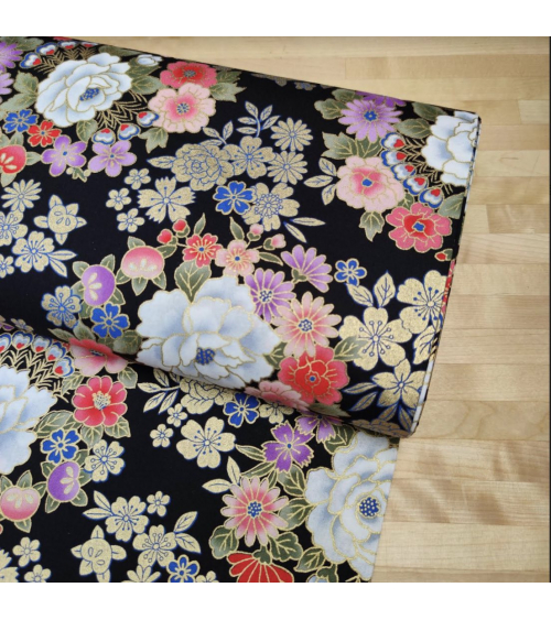 Japanese fabric with multicolor and golden flowers on black.