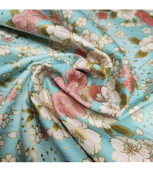 Japanese cotton satin slub fabric "Hanafubuki" in light blue.